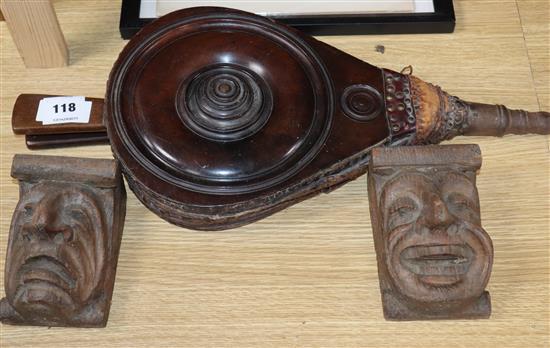 A 19th century set of mahogany bellows and a pair of carved corbels